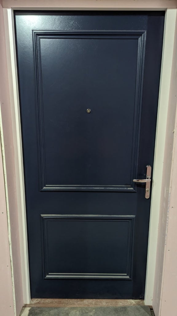 Our beautiful front doors in navy blue with chrome ironmongery